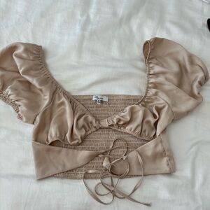 Gold top with balloon-ish shoulders and cut out